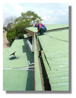 The ends of the laminates that overhang the gutters can be cut with a small grinder with a metal cutting disk The use of roofing membranes on Costa Rican homes